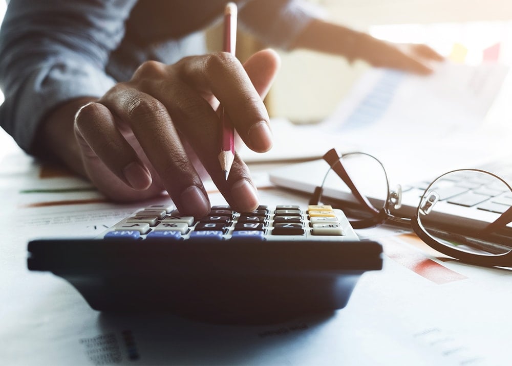accountant using calculator