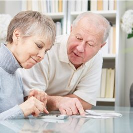 older couple looking at tax paperwork