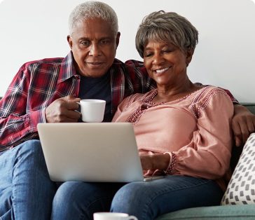 senior couple on laptop