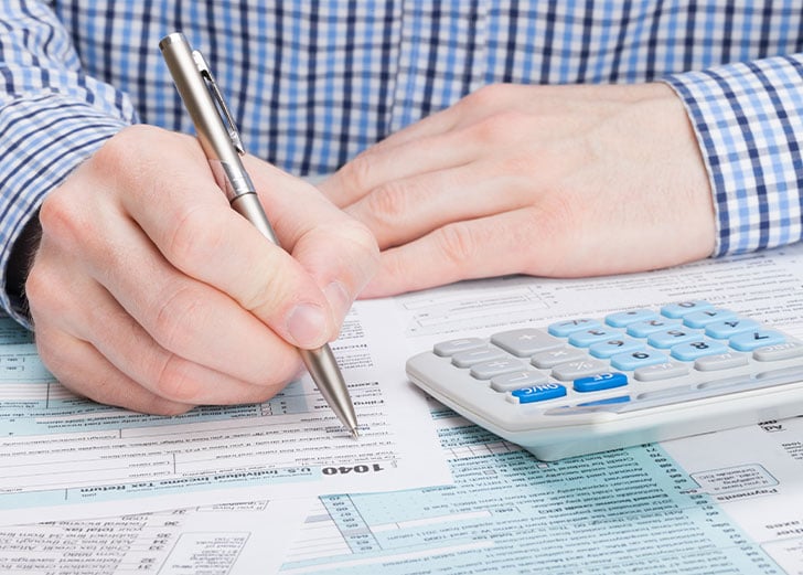 taxpayer filling out tax form