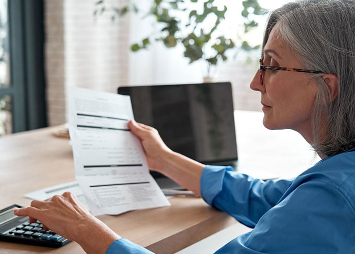 business owner calculating financial needs for retirement