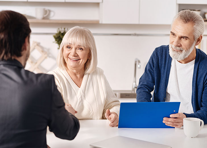 older couple reviewing social security plans with a financial advisor in worthington, ohio