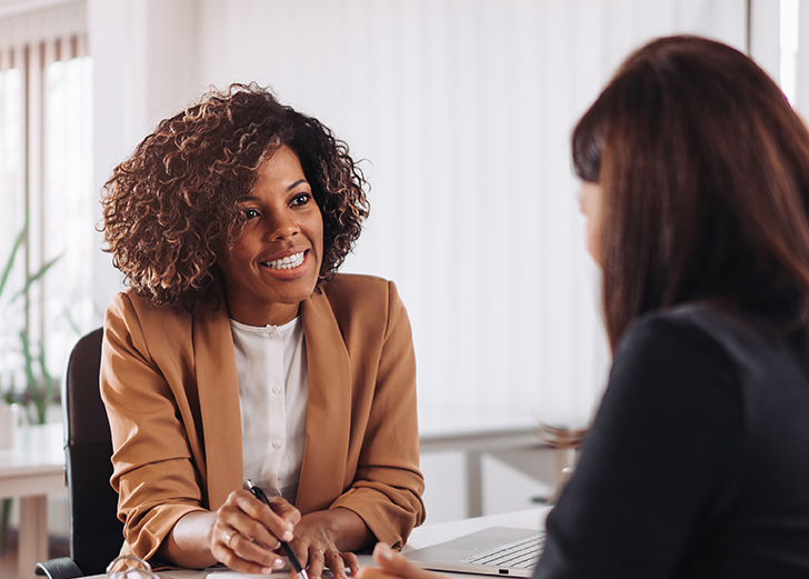 women discussing what a breach of fiduciary duty is