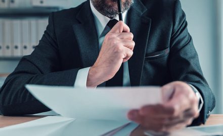 a fiduciary agent reading a paper