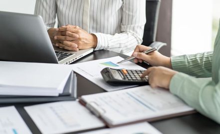 Business women checking annual financial statements