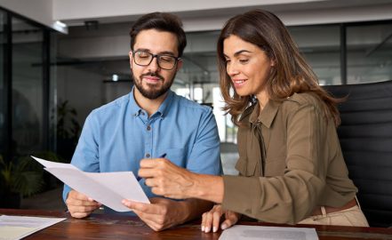 A financial advisor talking with a client