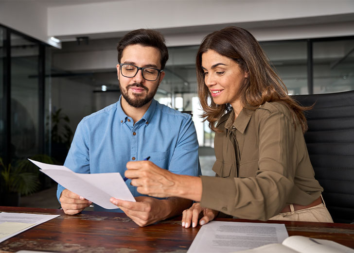 A financial advisor talking with a client