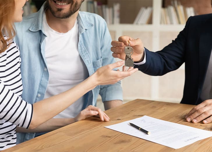 A couple receiving house keys